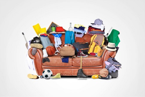 Cluttered loft space in a Kingston home before clearance